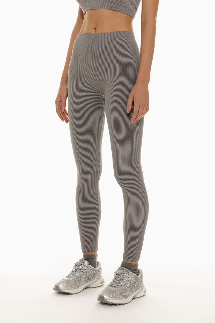 Front view showing the clean, minimal design and fit of the grey leggings.