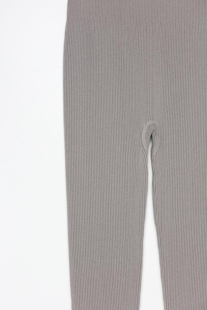 Detailed product shot showing the leggings' sleek, seamless edges and quality fabric.