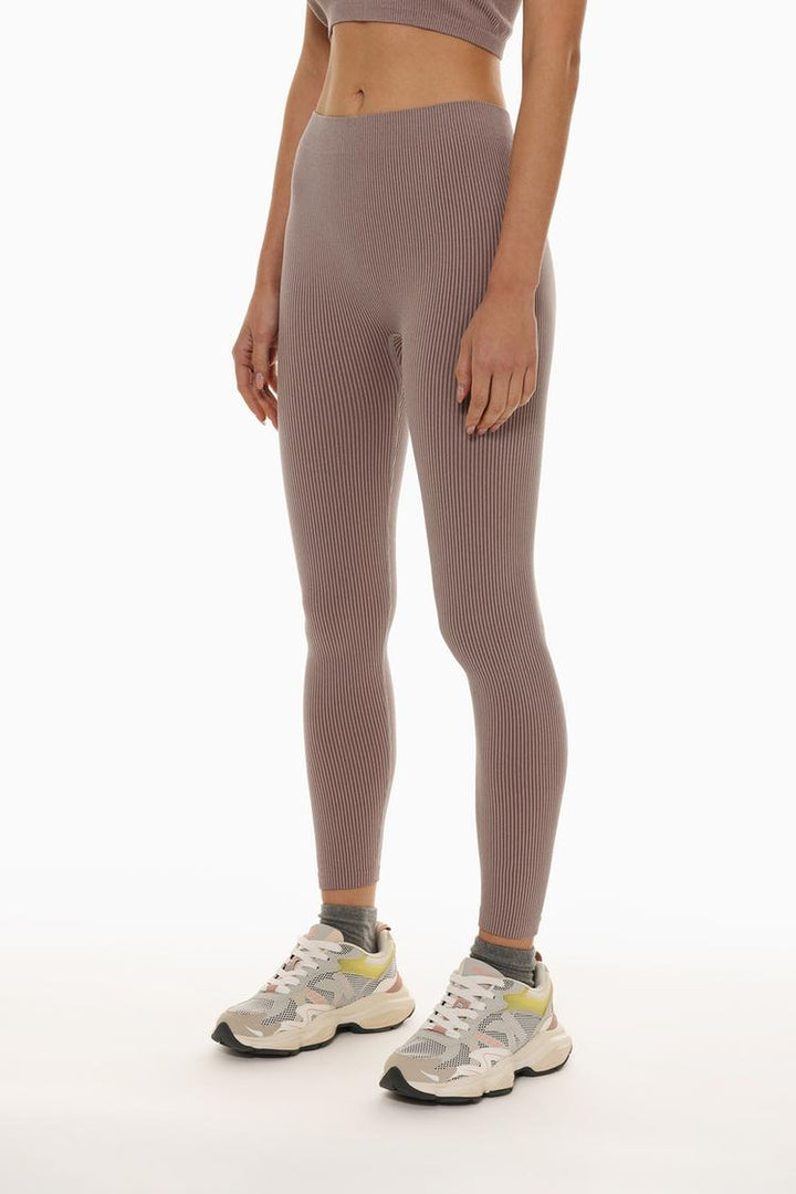 Front view showcasing the clean lines and smooth texture of the pink leggings.