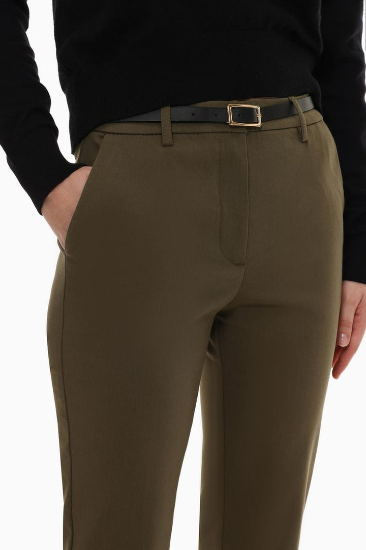 Detailed product display of brown slim fit trousers with a belt, crafted for lasting durability