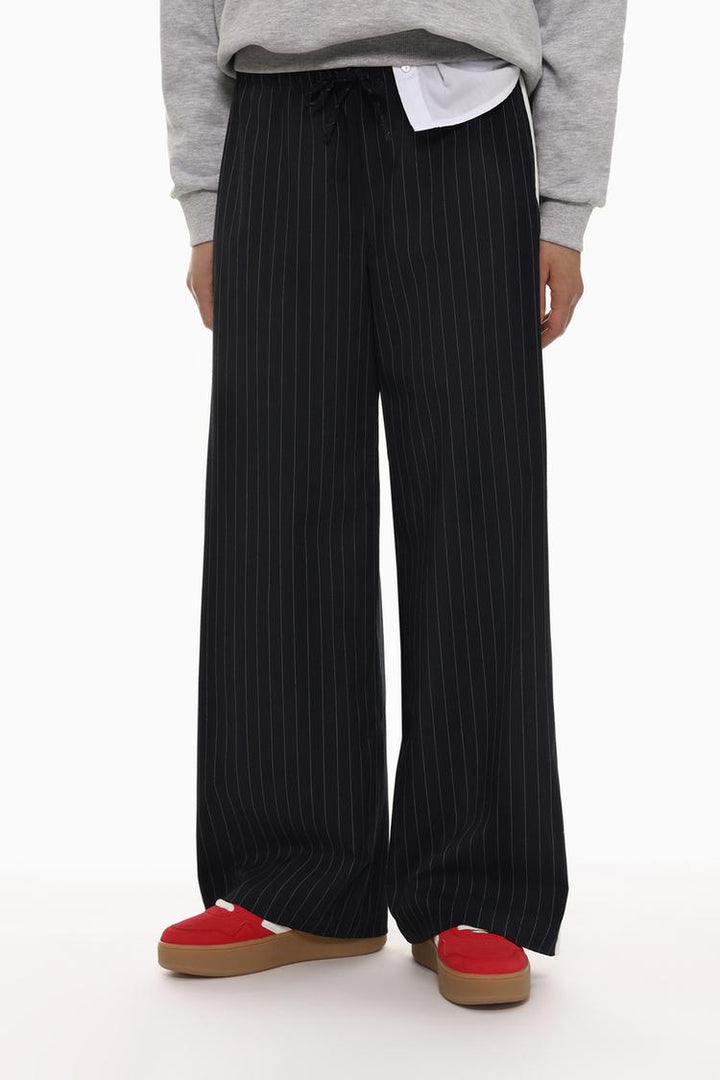 Front view of black smart trousers with a waistband, perfect for a formal or semi-formal look