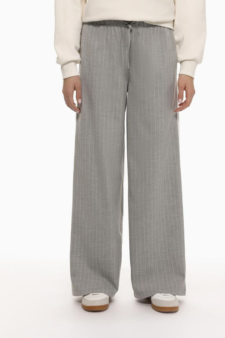 Front view of grey smart trousers with a waistband, perfect for office or formal wear