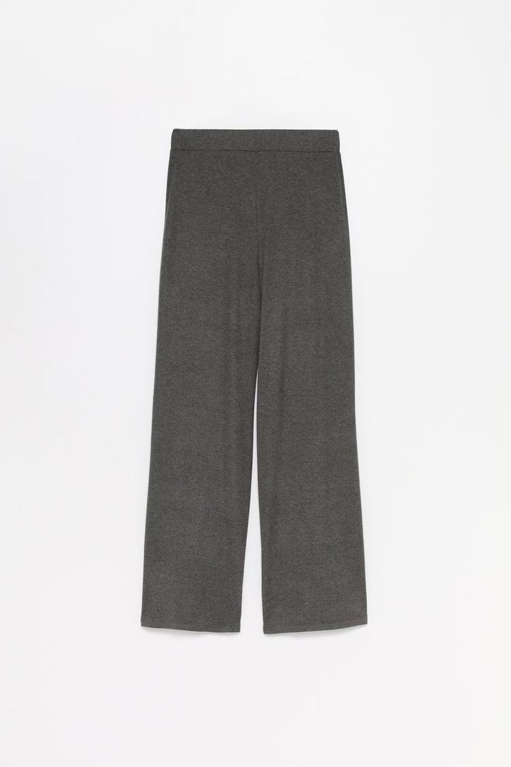 A comprehensive product shot of the grey trousers, presenting their overall structure and quality craftsmanship.