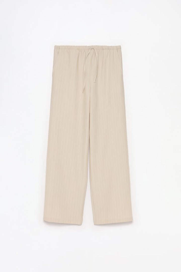 Full product view of beige straight-fit trousers, suitable for diverse styling needs