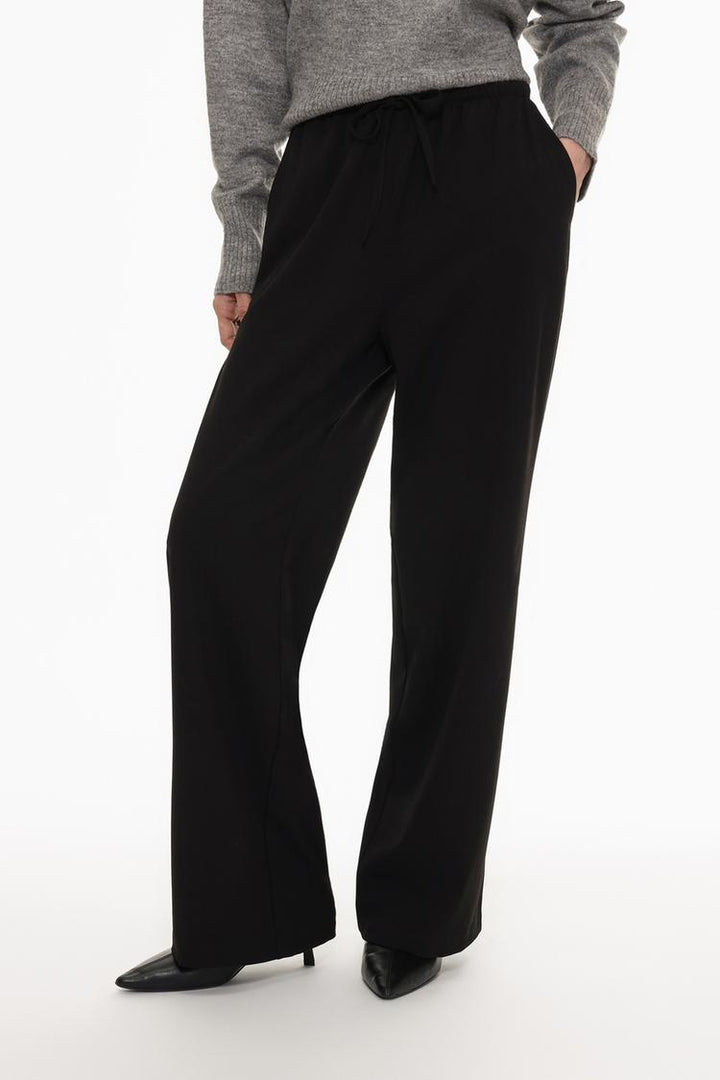 Front view of black straight-fit trousers, perfect for both formal and casual occasions