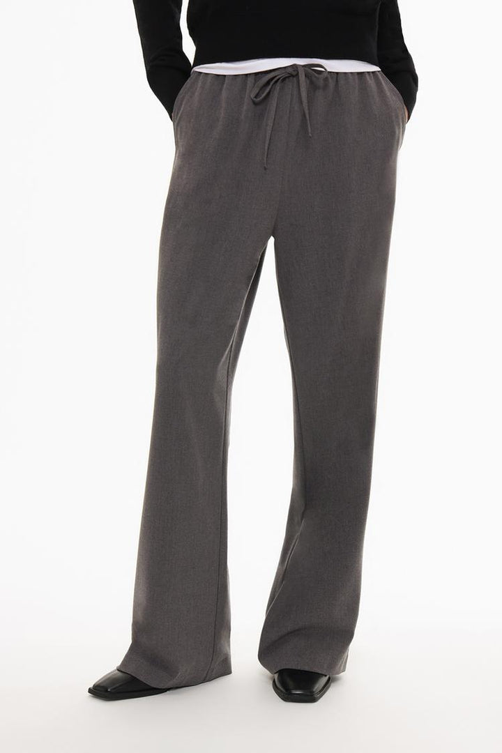 Front view of grey straight-fit trousers, highlighting their stylish and clean design