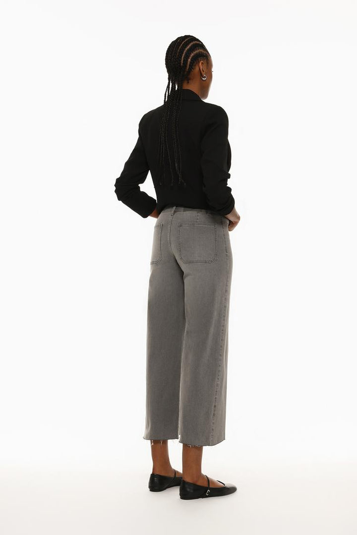 Rear view showcasing the flattering high waist and structured back pockets.