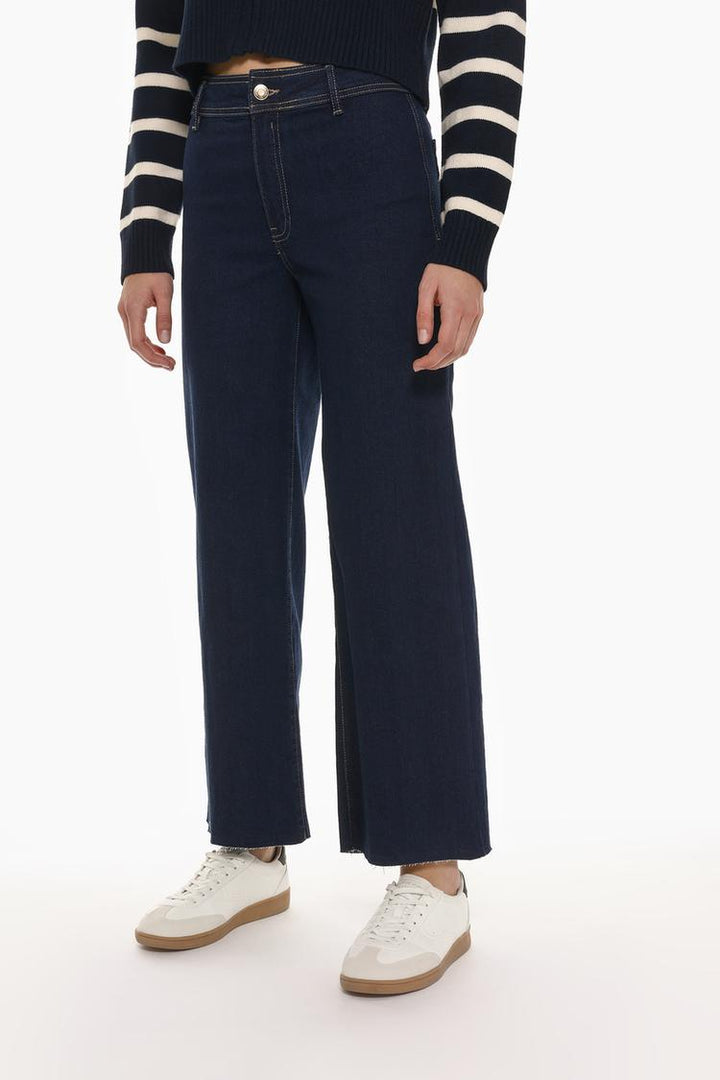 Front view of the black culotte jeans, highlighting the high-waist design and clean, minimalist finish.
