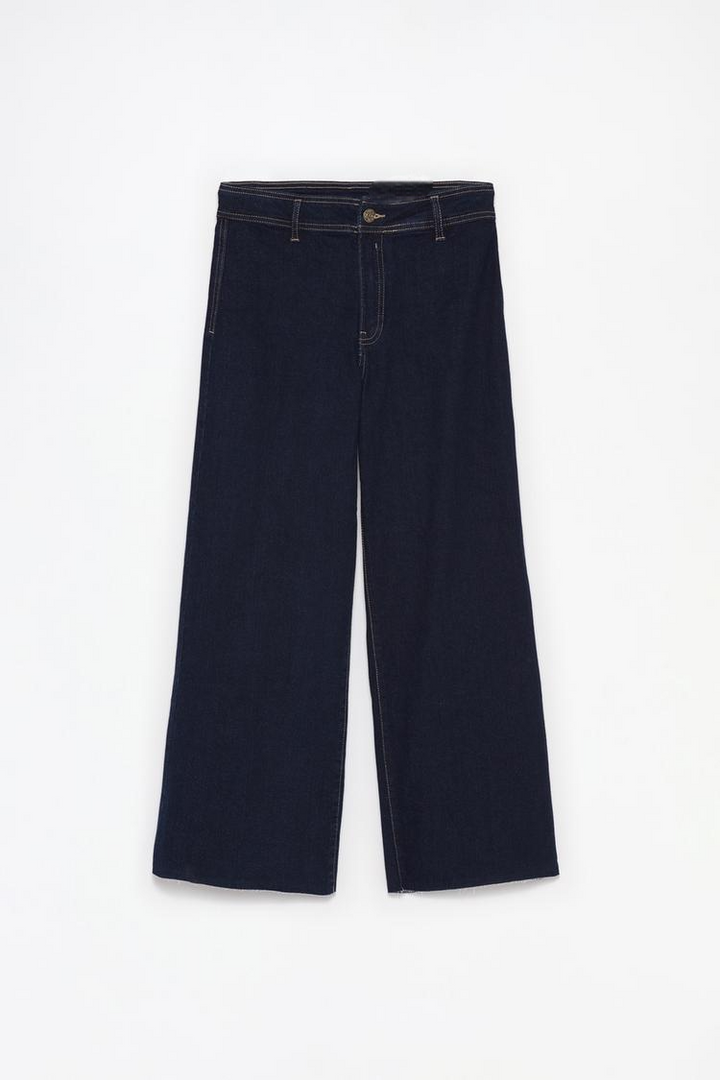 Complete product shot of the black culotte jeans, emphasizing the wide-leg design and durable, stretchy material.

