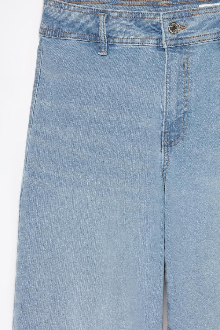 Close-up image of the blue culotte jeans, showcasing the durable stretch fabric and fine attention to detail.