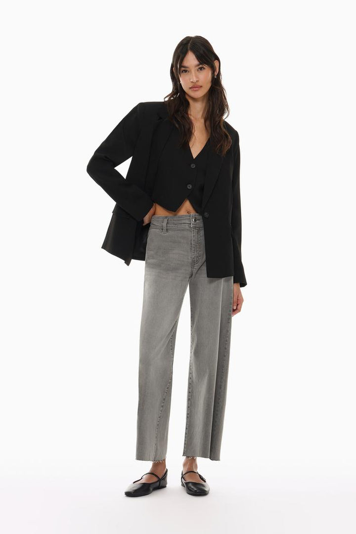 Full-body shot of the grey culotte jeans, showcasing the wide-leg cut and relaxed silhouette.

