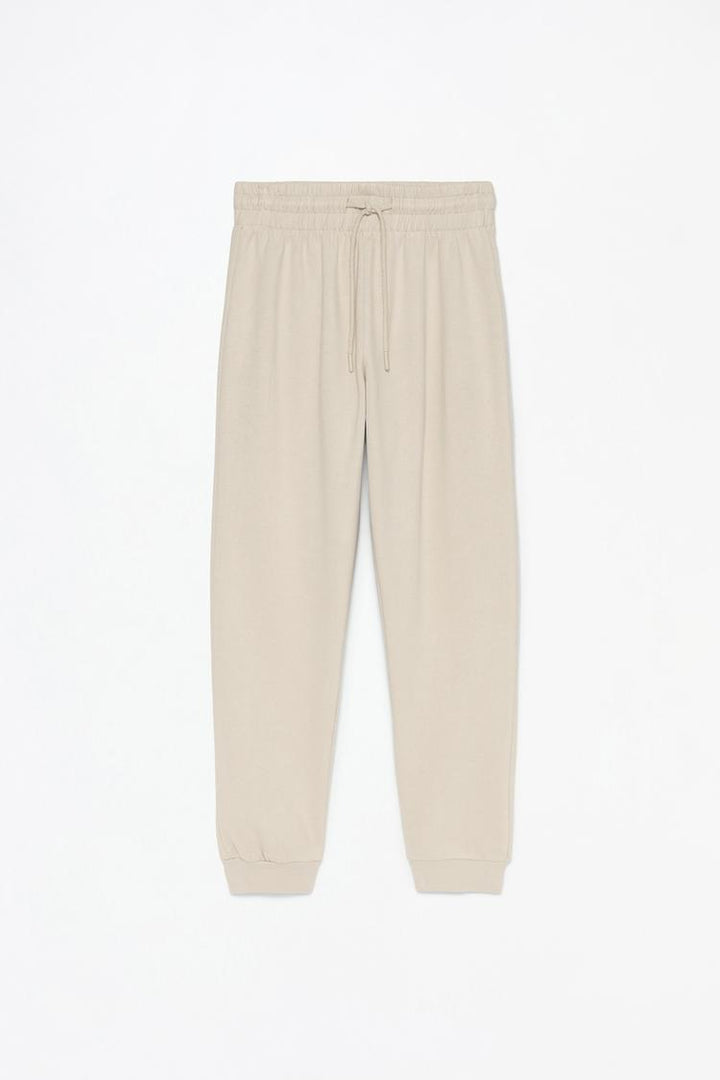 Beige tracksuit bottoms, designed for comfort and a relaxed fit.
