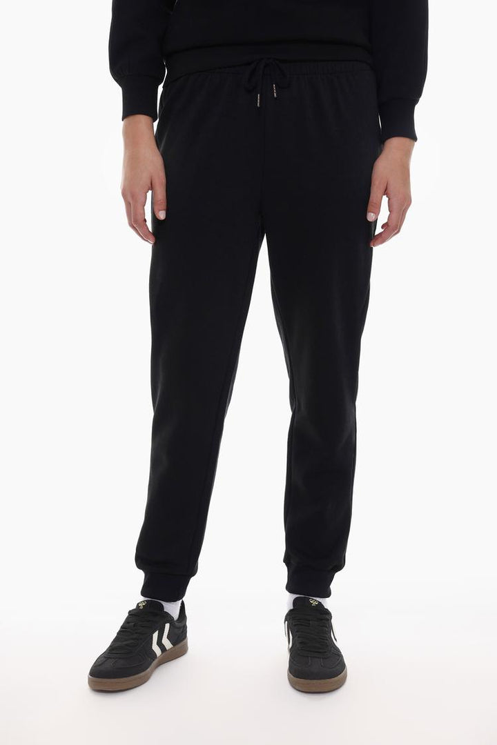 Black tracksuit bottoms designed for a comfortable and stylish fit.