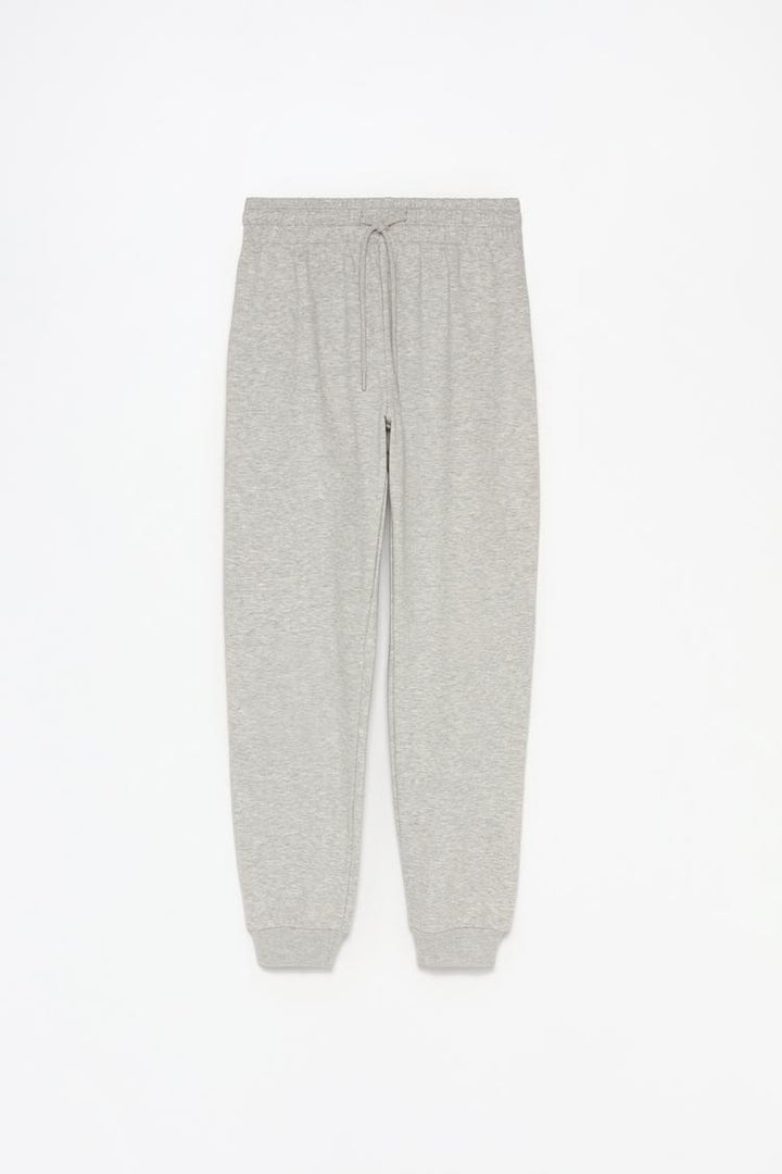 Full product view of grey tracksuit bottoms showing the complete design.