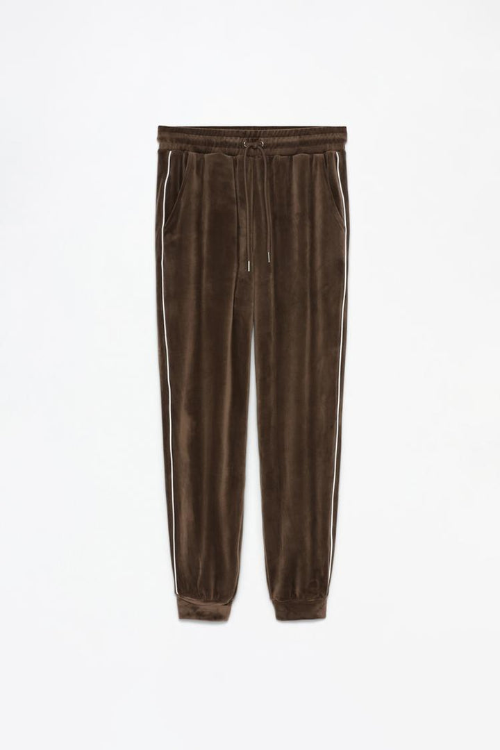 Full product view of brown velvet joggers demonstrating the complete design.