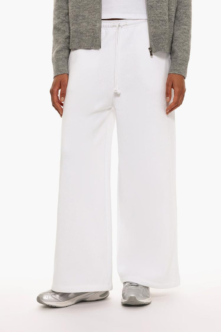 Zoomed-in shot of white wide-leg plush trousers showcasing fabric details.