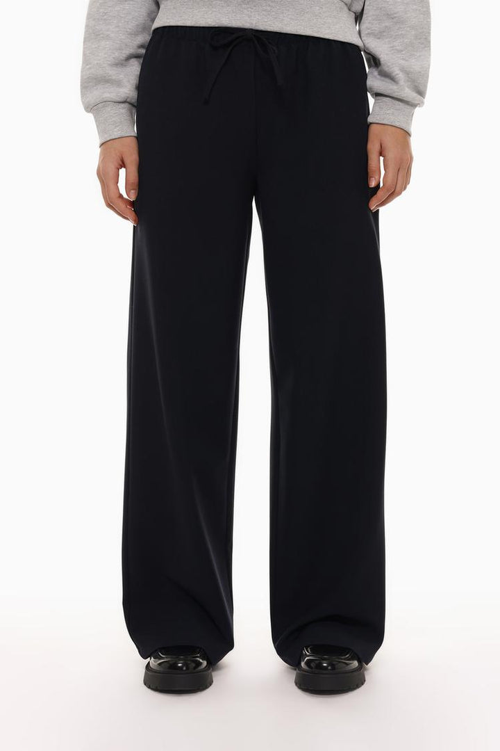 Front view of black wide-leg smart trousers, combining elegance with practicality