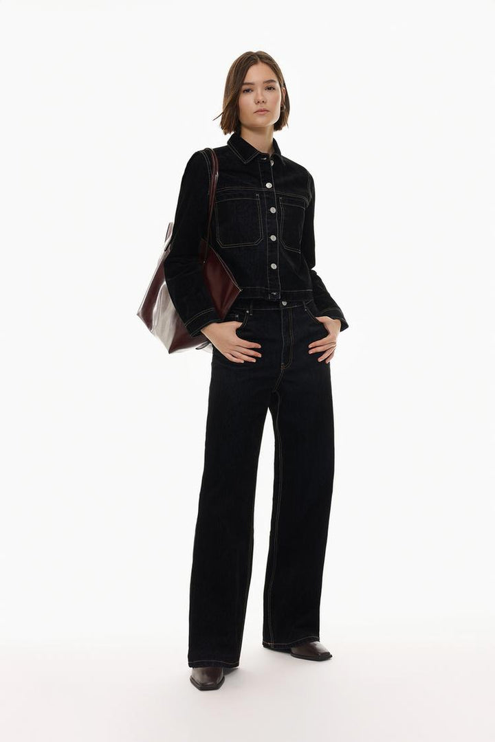 Luxurious wide-leg jeans crafted from soft velvety fabric, blending comfort and elegance in a timeless silhouette.

