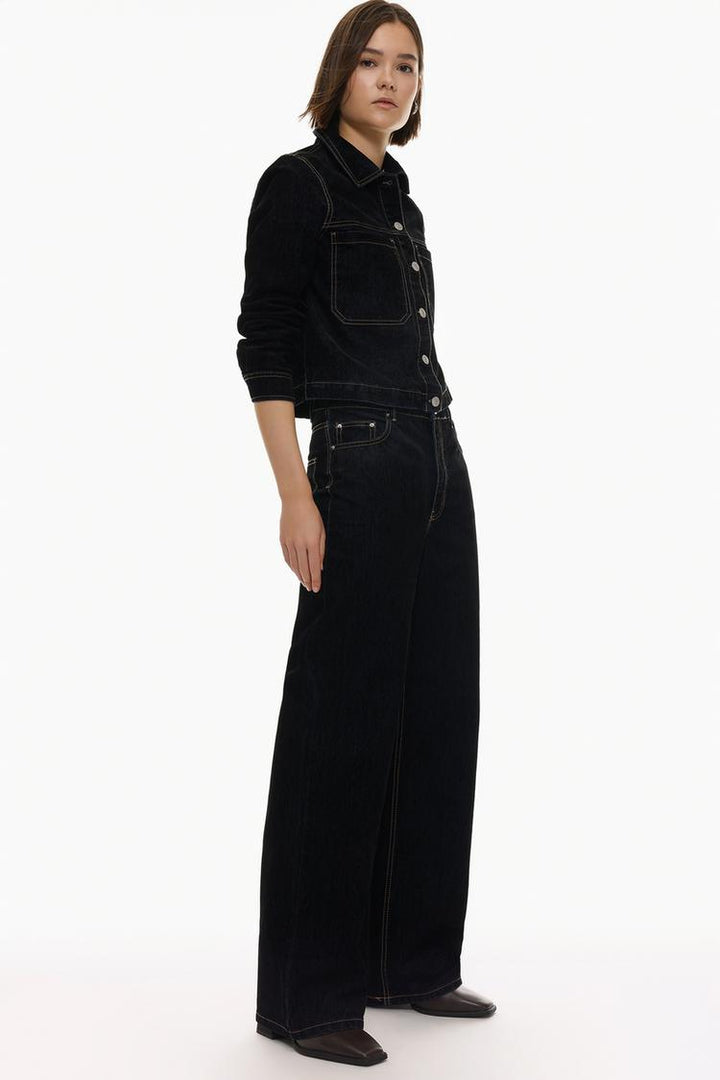 Full-body shot of the velvety jeans styled for a chic and contemporary outfit, perfect for day-to-night transitions.

